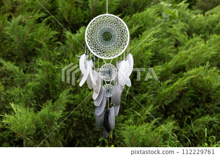 Handmade dream catcher with feathers threads and beads rope hanging 112229761