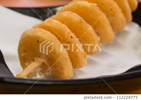 Hurricane potato skewers 112229775