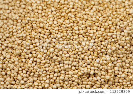 Dry quinoa uncooked closeup texture. Healthy eating 112229809