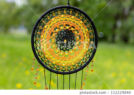 Handmade dream catcher with feathers threads and beads rope hanging Handmade dream catcher with feathers threads and beads rope hanging 112229840