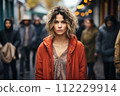 AI-generated content. Portrait of sad mature woman looking at camera. Evening, city view, outdoor.  112229914