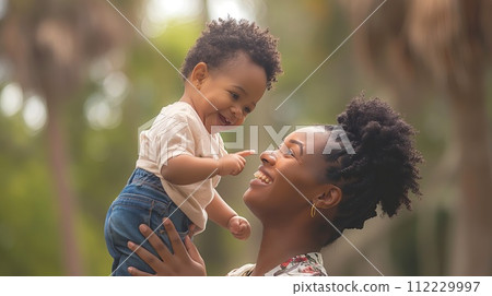 Portrait of happy african american mother and baby in park. Mother's day 112229997