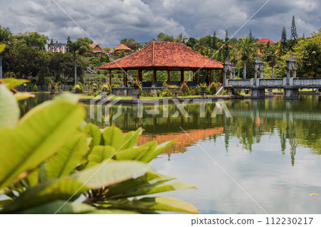 Water Palace Taman Ujung in Bali. Balinese architecture with lake on sunny day 112230217