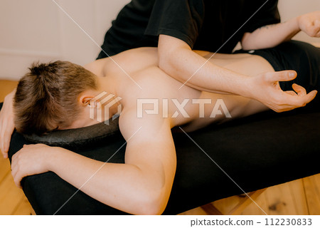 Chiropractic, osteopathy, manual therapy.Therapist doing healing treatment on man's back. Alternative medicine, pain relief concept 112230833