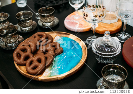 Artisanal Chocolate Pretzels and Elegant Glassware Artisanal Chocolate Pretzels and Elegant Glassware 112230928