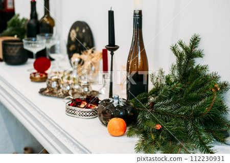 Elegant Holiday Mantelpiece with Festive Decor 112230931