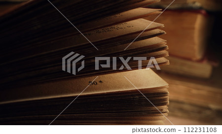 Opened saved medieval book with ancient writings. Religious literature, archival Opened saved medieval book with ancient writings. Religious literature, archival 112231108
