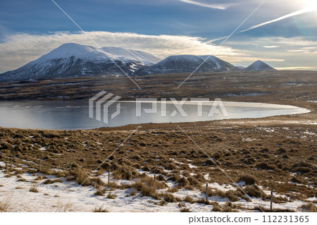 Water of a fjord and mountains, Hvitserkur, Iceland 112231365