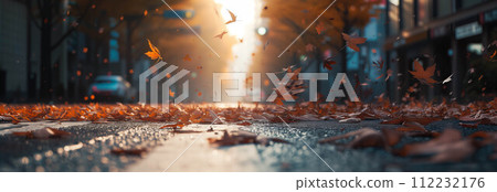 Autumn maple leaves falling on the city street. 112232176