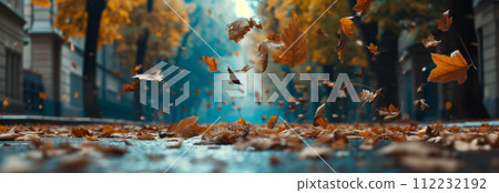 Autumn maple leaves falling on the city street. Autumn maple leaves falling on the city street. 112232192