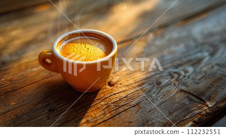 A Cup of Coffee on a Wooden Table 112232551