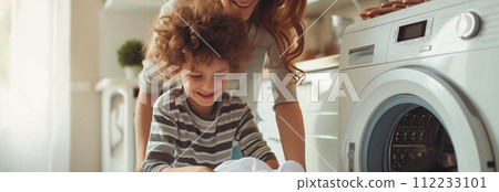 Caucasian mother and son washing clothes together in the house. 112233101