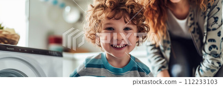 Caucasian mother and son washing clothes together in the house. 112233103