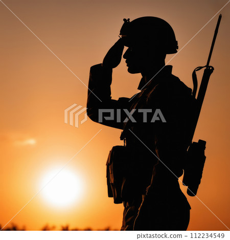 Silhouette Of A Soldier Saluting During Sunset 112234549