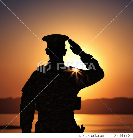Silhouette Of A Soldier Saluting During Sunset Silhouette Of A Soldier Saluting During Sunset 112234550