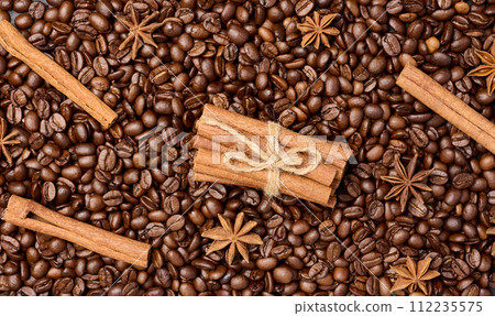 Roasted coffee beans, cinnamon sticks and star anise, full frame Roasted coffee beans, cinnamon sticks and star anise, full frame 112235575