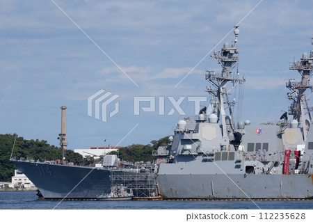 Arleigh Burke-class missile destroyer USS Ralph Johnson moored at Yokosuka Naval Facility Arleigh Burke-class missile destroyer USS Ralph Johnson moored at Yokosuka Naval Facility 112235628