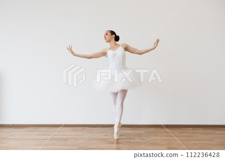 Woman in tutu motion, balance flexibility concept, lifestyle. 112236428