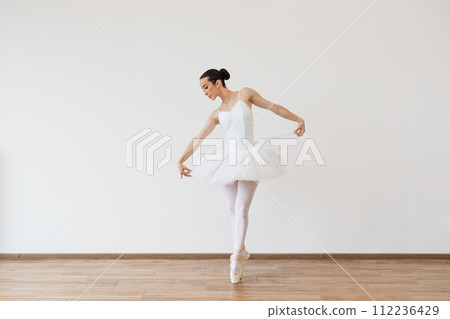 Woman in tutu motion, balance flexibility concept, lifestyle. Woman in tutu motion, balance flexibility concept, lifestyle. 112236429