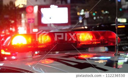 Police lights that glow red at night 112236530