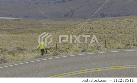 Photographer Capturing Condors on Mountain Road at Sunset Photographer Capturing Condors on Mountain Road at Sunset 112238511