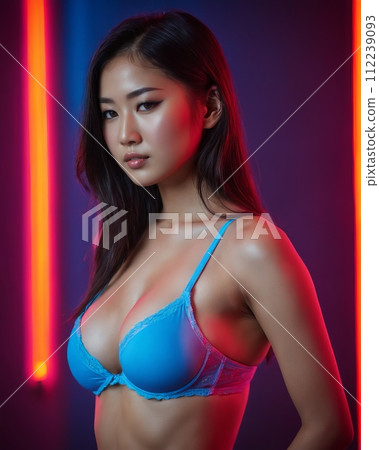 an asian woman in a blue bra top 112239093