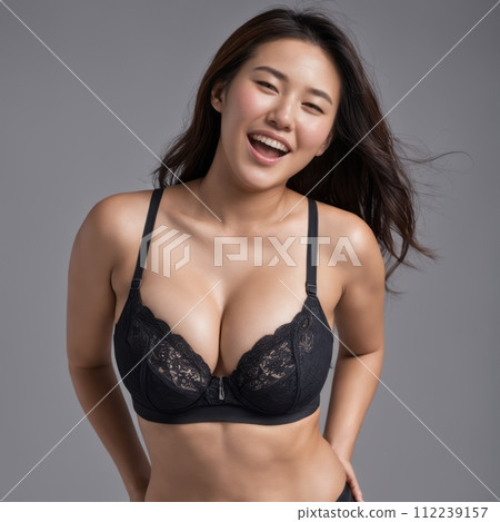 an asian woman wearing a black bra and panties 112239157