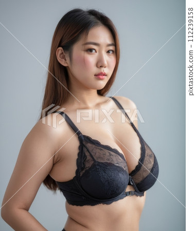 an asian woman wearing a black bra and panties an asian woman wearing a black bra and panties 112239158