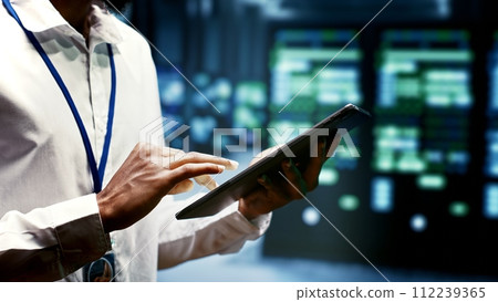 Close up of mechanic doing yearly infrastructure servicing in blockchain technology application specific integrated circuit high tech workplace. Professional running operations in crypto mining farm 112239365
