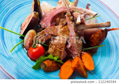 BBQ mutton ribs served with fresh figs 112240594