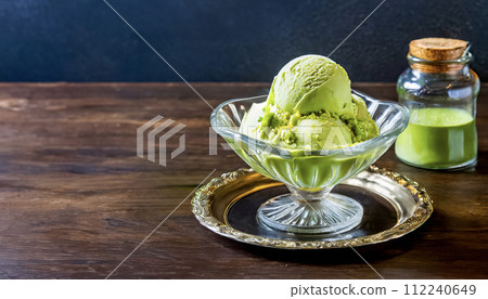 Image of matcha flavored ice cream taken inside a cafe Image of matcha flavored ice cream taken inside a cafe 112240649