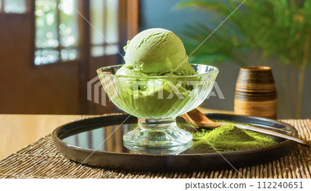 Image of matcha flavored ice cream taken inside a cafe Image of matcha flavored ice cream taken inside a cafe 112240651