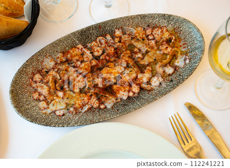 Octopus carpaccio with aromatic oil and smoked paprika 112241221