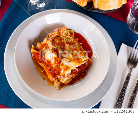 Lasagna a la Bolognese with bechamel sause 112241302