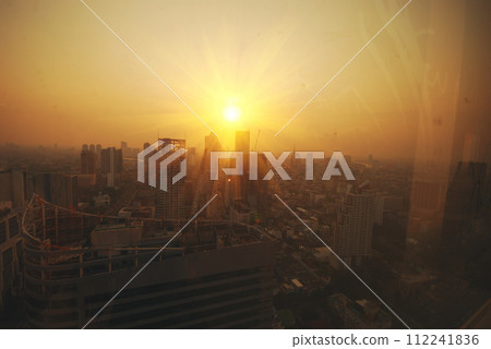 Sunset Amazing Bangkok city skyline with blue sky. Golden time Beautiful skyscraper bangkok midtown landscape. Capital building background modern office district. downtown City night life Sunset Amazing Bangkok city skyline with blue sky. Golden time Beautiful skyscraper bangkok midtown landscape. Capital building background modern office district. downtown City night life 112241836