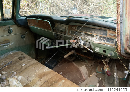 The driver's seat of a rotten old car, classic car The driver's seat of a rotten old car, classic car 112241955