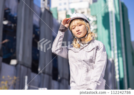 Business Woman in work clothes working at a construction site 112242786