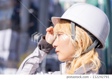 Business Woman in work clothes working at a construction site 112242791