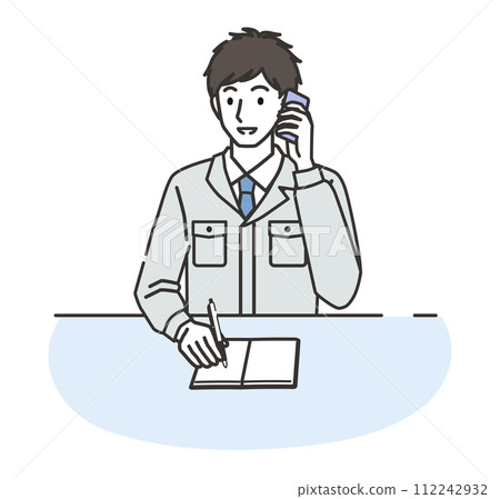 A man wearing work clothes taking notes while on the phone 112242932