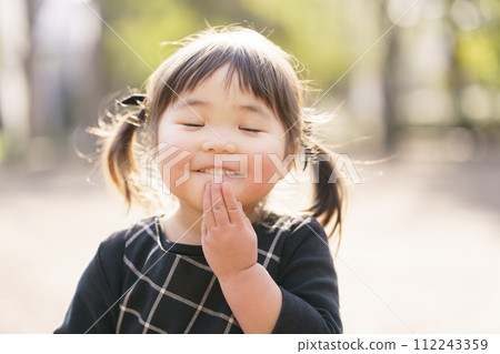 little girl smiling in the park little girl smiling in the park 112243359
