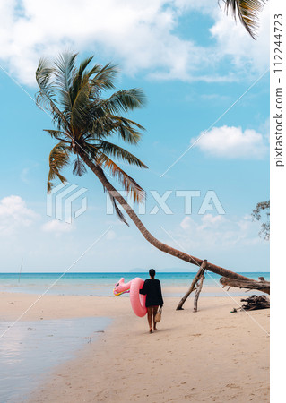 Tropical beach,Coconut trees and blue sea on a summer day 112244723