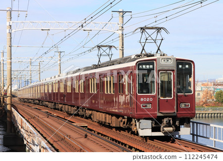 Hankyu Kobe Line 8000 series train running near Kanzakigawa Station Hankyu Kobe Line 8000 series train running near Kanzakigawa Station 112245474