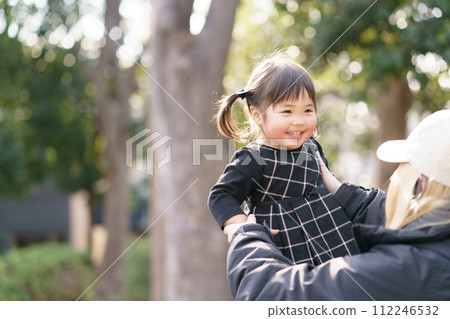 Parents and children playing in the autumn park 112246532
