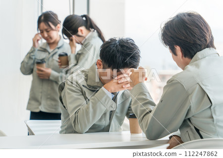 A young male businessman in work clothes is scolded and lectured by his boss A young male businessman in work clothes is scolded and lectured by his boss 112247862