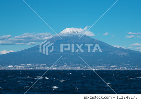 Mt. Fuji looking across the rough waves of Suruga Bay Mt. Fuji looking across the rough waves of Suruga Bay 112248175