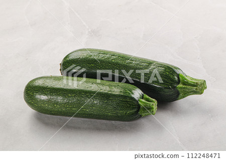 Raw green ripe zucchini vegetable 112248471