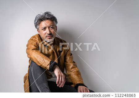 Senior male fashion sitting Senior male fashion sitting 112248863