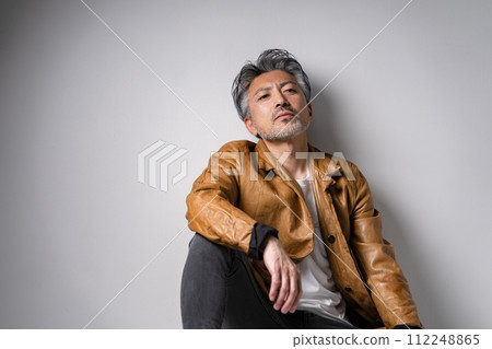 Senior male fashion sitting Senior male fashion sitting 112248865