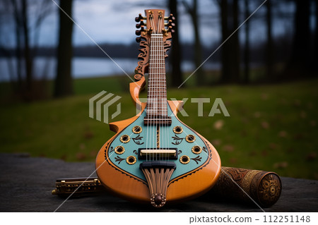 Elegant mandolin and harmonica on wooden surface 112251148