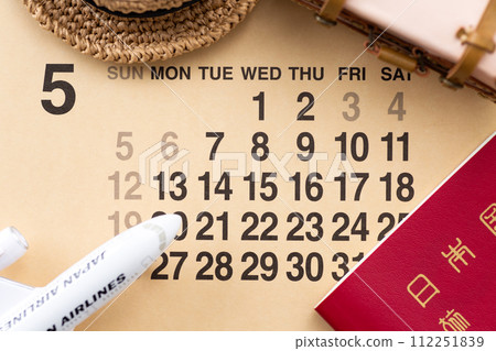 Travel bag trunk, airplane, passport, and May calendar Travel bag trunk, airplane, passport, and May calendar 112251839